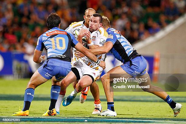 Tom Marshall of the Chiefs is tackled during the round six Super Rugby match between the Force and the Chiefs at nib Stadium on March 22, 2014 in...