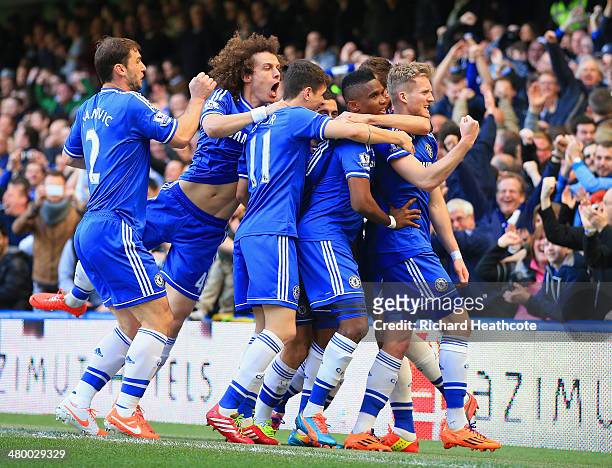 Andre Schurrle of Chelsea celebrates scoring his second goal with Nemanja Matic, Eden Hazard, David Luiz, Samuel Eto'o, Oscar, Branislav Ivanovic of...