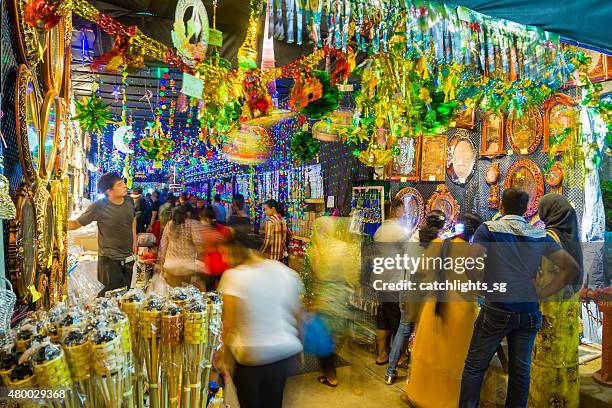 holiday bazaar at geylang serai, singapore - singapore night market stock pictures, royalty-free photos & images