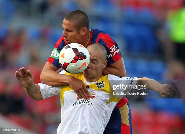 Stein Huysegems of the Phoenix and Josh Mitchell of the Jets contest a header during the round 24 A-League match between the Newcastle Jets and...