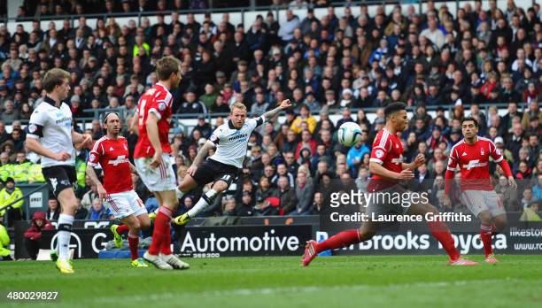 Johnny Russell of Derby County smashes in the fourth goal during the Sky Bet Championship match between Derby County and Nottingham Forest at iPro...