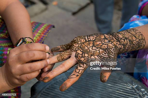 rajasthani woman's hand with henna tattoo - henna tattoo stock pictures, royalty-free photos & images