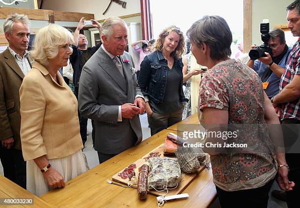 Camilla, Duchess of Cornwall and Prince Charles, Prince of Wales are shown local produce as they visit Humble by Nature Farm on July 9 2015 in...