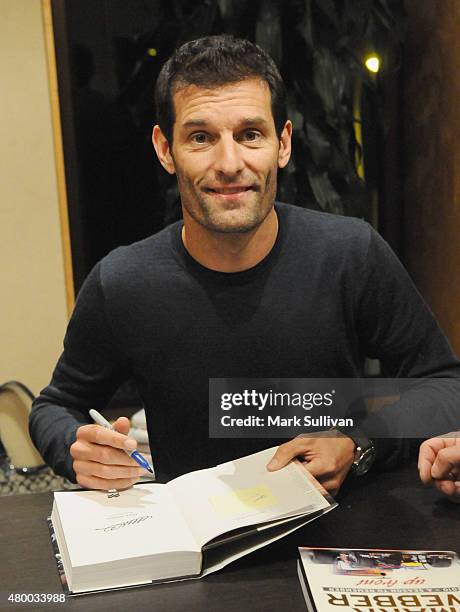 Former Australian Formula One driver Mark Webber signs his autobiography "Aussie Grit" at Sofitel Hotel on July 9, 2015 in Sydney, Australia. Webber,...