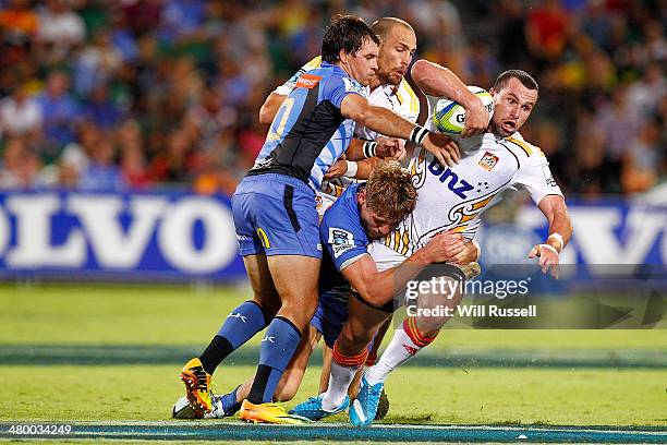 Tom Marshall of the Chiefs is tackled during the round six Super Rugby match between the Force and the Chiefs at nib Stadium on March 22, 2014 in...