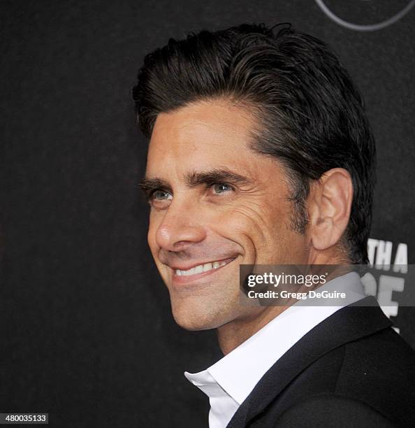 Actor John Stamos arrives at the 2nd Annual Rebel With A Cause Gala at Paramount Studios on March 20, 2014 in Hollywood, California.