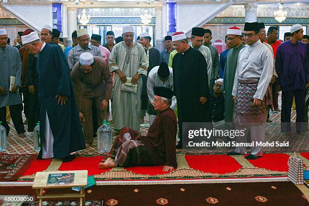 Malaysia Prime Minister Najib Razak seat before start read the Koran during holy month of ramadan inside the National mosque July 9, 2015 in Kuala...