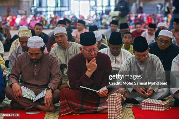 Malaysia Prime Minister Najib Razak read the koran during holy month of ramadan inside the National mosque on July 9, 2015 in Kuala Lumpur, Malaysia....