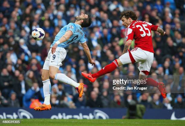 Fernando Amorebieta of Fulham fouls Alvaro Negredo of Manchester Cit in the area during the Barclays Premier League match between Manchester City and...
