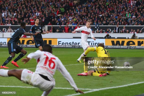 Alexandru Maxim of Stuttgart scores the opening goal against Rene Adler, keeper of Hamburg during the Bundesliga match between VfB Stuttgart and...