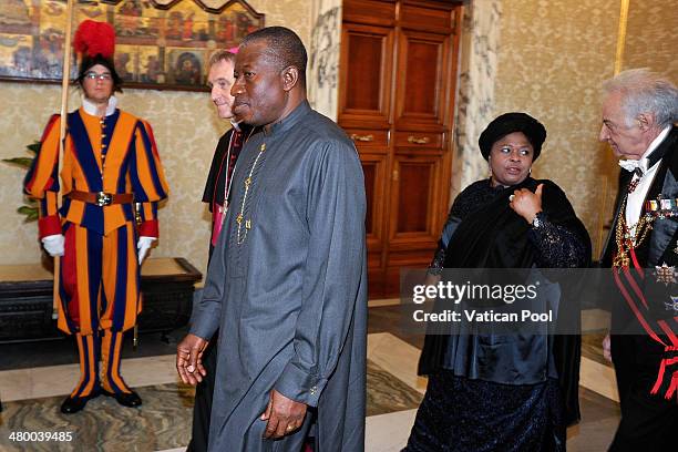 President of Nigeria Goodluck Jonathan and his wife Patience Jonathan arrive at Pope Francis' private library in the Apostolic Palace for a meeting...