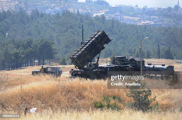 German soldiers check military vehicles following the Patriot missiles, stationed on the Turkish side of the border under the Nato pact received...