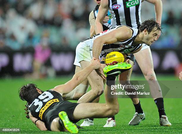 Alan Toovey of the Magpies and Justin Westhoff of the Power during the round 15 AFL match between Port Adelaide Power and Collingwood Magpies at...