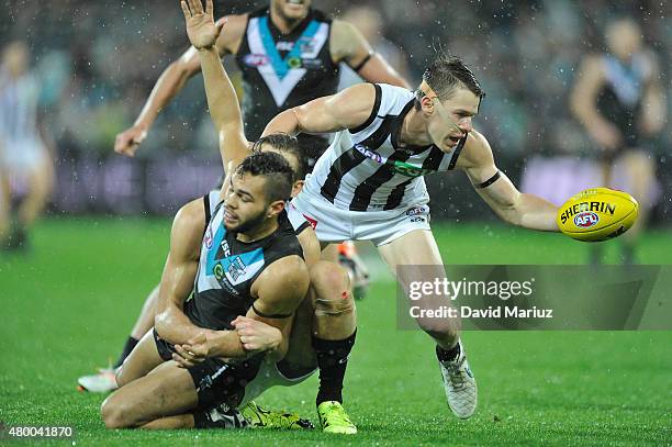 Tom Langdon of the Magpies and Jarman Impey of the Power during the round 15 AFL match between Port Adelaide Power and Collingwood Magpies at...