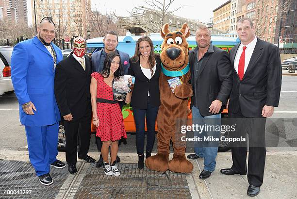 Wrestlers Brodus Clay, Sin Cara, The Miz, Diva AJ Lee, WWE Chief Brand Officer Stephanie McMahon, Scooby Doo WWE Wrestlers Triple H, and Kane pose...