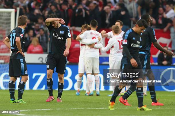 Heiko Westermann of Hamburg reacts with his team mates after the Bundesliga match between VfB Stuttgart and Hamburger SV at Mercedes-Benz Arena on...