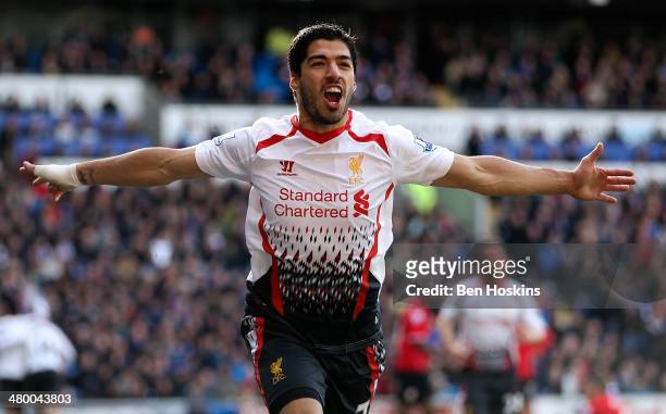 Luis Suarez of Liverpool celebrates after scoring his team's fourth goal of the game during the Barclays Premier League match between Cardiff City...