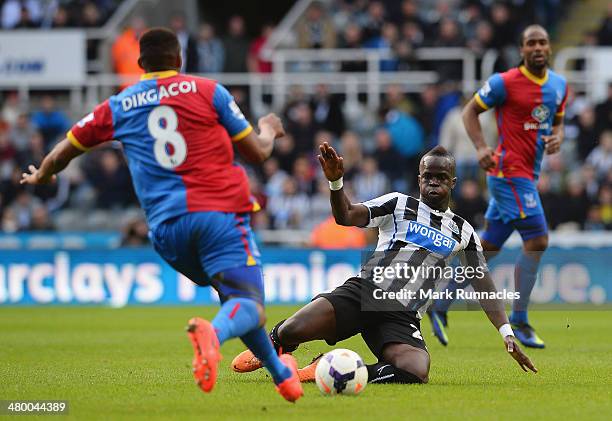 Cheik Ismael Tiote of Newcastle United challenges Kagisho Dikgacoi of Crystal Palace during the Barclays Premier League match between Newcastle...