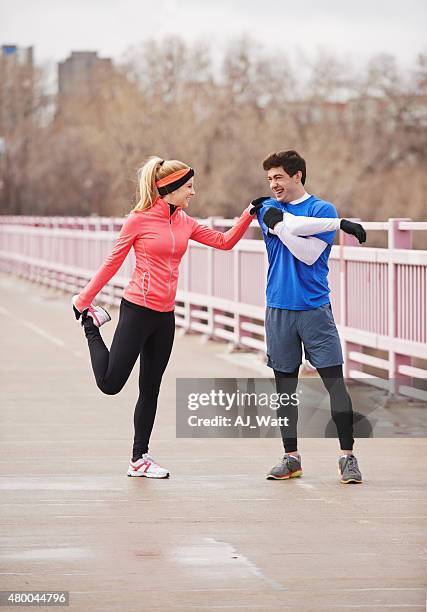 warming up for their run - runner warming up stock pictures, royalty-free photos & images