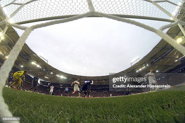 Alexandru Maxim of Stuttgart scores the opening goal against Rene Adler, keeper of Hamburg during the Bundesliga match between VfB Stuttgart and...