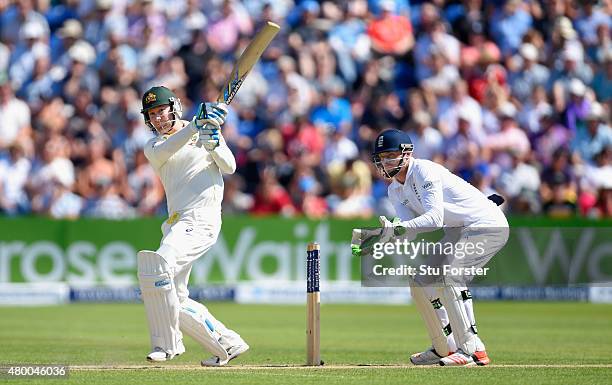 Australia batsman Michael Clarke picks up some runs watched by Jos Buttler during day two of the 1st Investec Ashes Test match between England and...