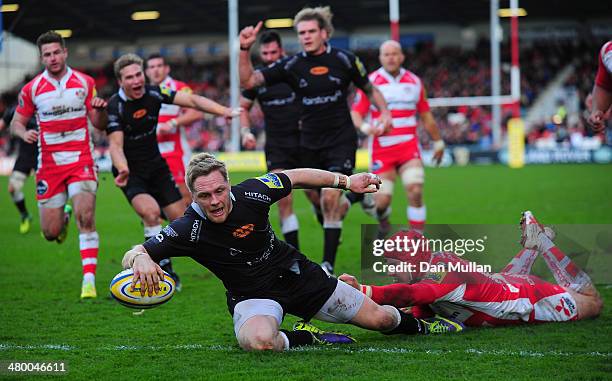 Alex Tait of Newcastle Falcons beats the tackle of Rob Cook of Gloucester to score a try during the Aviva Premiership match between Gloucester and...