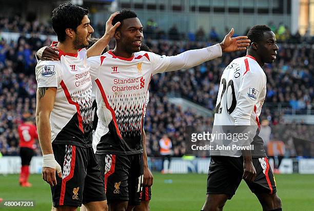 Daniel Sturridge of Liverpool celebrates with Luis Suarez after scoring the fifth goal for Liverpool during the Barclays Premier League match between...
