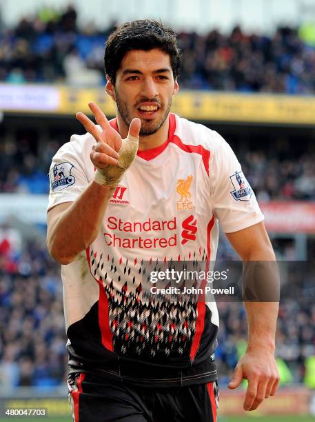 Luis Suarez of Liverpool celebrates after scoring the sixth goal and a hat-rick during the Barclays Premier League match between Cardiff City and...