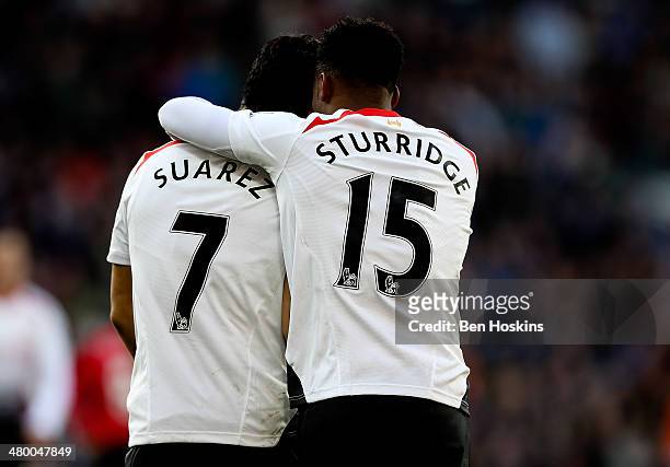 Daniel Sturridge of Liverpool celebrates with team mate Luis Suarez after scoring his team's fifth goal during the Barclays Premier League match...