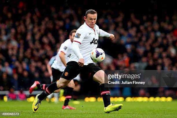 Wayne Rooney of Manchester United scores the opening goal with a long range shot during the Barclays Premier League match between West Ham United and...