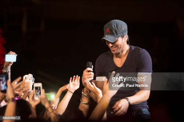 Musician Enrique Iglesias stands amid fans during a performance at the United Center, Chicago, Illinois, August 4, 2012.