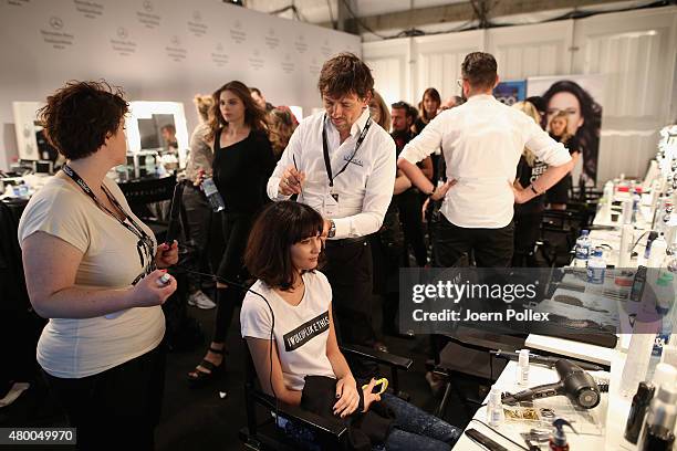 Model is being styled backstage ahead of the Dimitri show during the Mercedes-Benz Fashion Week Berlin Spring/Summer 2016 at Brandenburg Gate on July...