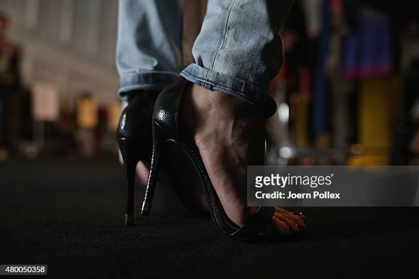 Model is seen backstage ahead of the Dimitri show during the Mercedes-Benz Fashion Week Berlin Spring/Summer 2016 at Brandenburg Gate on July 9, 2015...