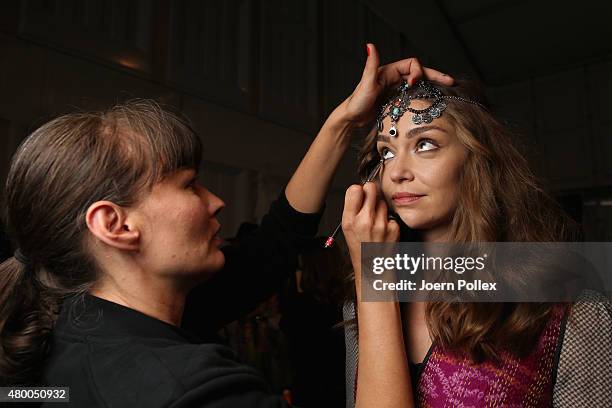 Model is seen backstage ahead of the Dimitri show during the Mercedes-Benz Fashion Week Berlin Spring/Summer 2016 at Brandenburg Gate on July 9, 2015...