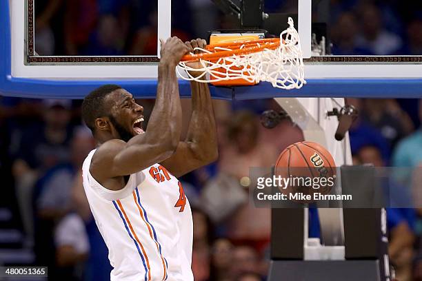 Patric Young of the Florida Gators dunks the ball in the second half while taking on the Pittsburgh Panthers during the third round of the 2014 NCAA...