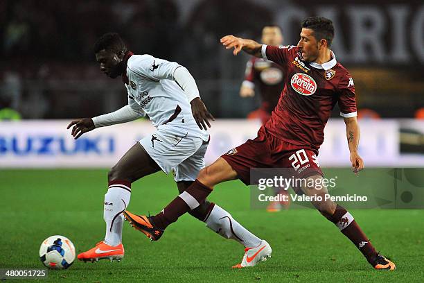 Giuseppe Vives of Torino FC tackles Joseph Alfred Duncan of AS Livorno Calcio during the Serie A match between Torino FC and AS Livorno Calcio at...