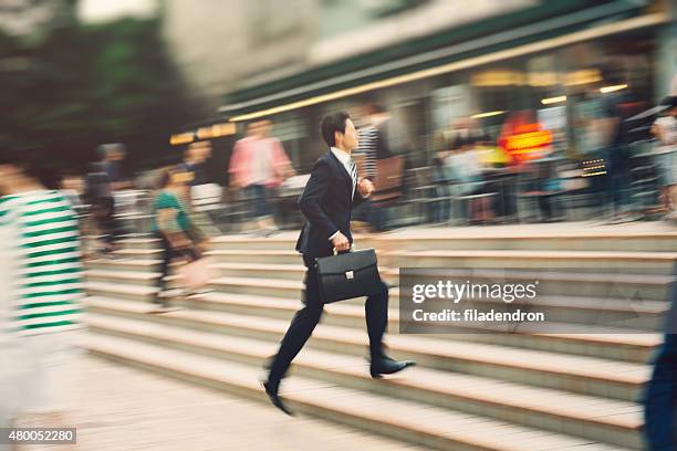 businessman running on the street - businessman running stock pictures, royalty-free photos & images