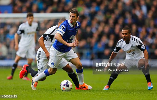 Seamus Coleman of Everton is closed down by Wayne Routledge of Swansea City during the Barclays Premier League match between Everton and Swansea City...