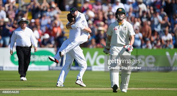 Australia batsman Chris Rogers leaves the field after being dismissed for 95 as bowler Mark Wood and Adam Lyth celebrate during day two of the 1st...
