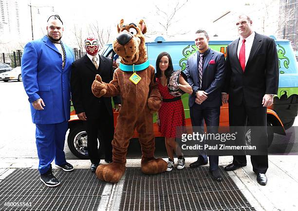 Wrestlers Brodus Clay, Sin Cara, Scooby Doo, Diva AJ Lee, The Miz, and Kane pose for a picture during the 'Scooby Doo! WrestleMania Mystery' New York...