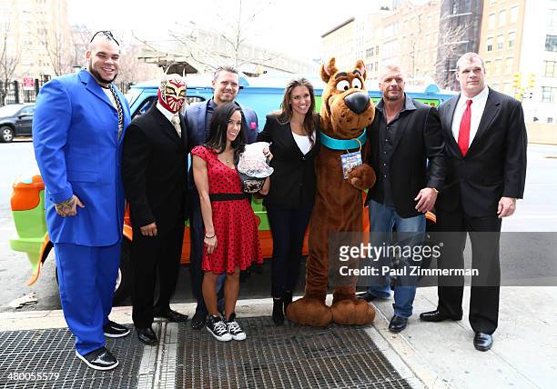 Wrestlers Brodus Clay, Sin Cara, The Miz, Diva AJ Lee, WWE Chief Brand Officer Stephanie McMahon, Scooby Doo WWE Wrestlers Triple H, and Kane pose...