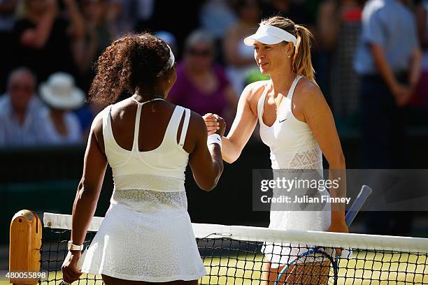 Serena Williams of the United States celebrates at the net after winning the Ladies Singles Semi Final match against Maria Sharapova of Russia during...