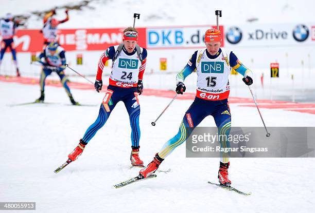 Alexey Volkov of Russia and Serhiy Semenov of Ukraine compete during the IBU Biathlon World Cup Men's 12.5 km pursuit race on March 22, 2014 in Oslo,...