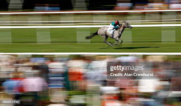 William Buick riding Lumiere easily win The John Deere EBF Stallions Maiden Fillies' Stakes at Newmarket racecourse on July 09, 2015 in Newmarket,...