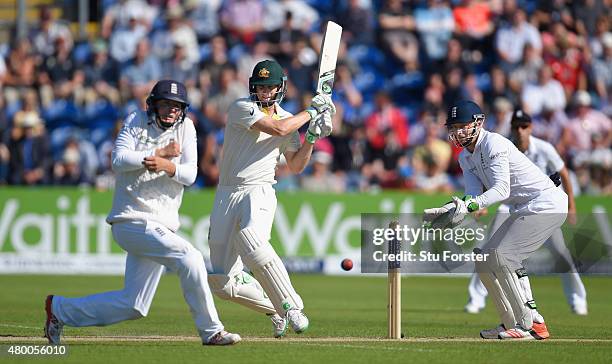 Australia batsman Adam Voges hits out as fielder Gary Ballance and Jos Buttler look on during day two of the 1st Investec Ashes Test match between...