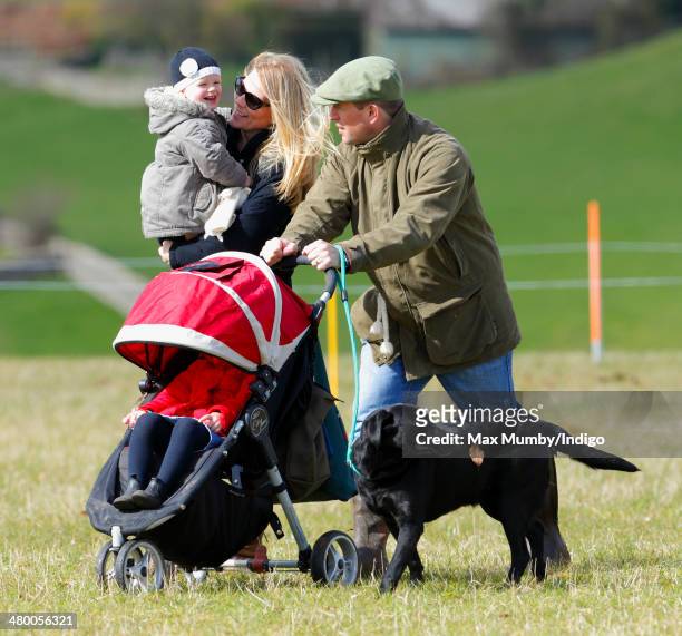 Peter Phillips and Autumn Phillips with their daughters Savannah Phillips & Isla Phillips walk the cross country course of the Gatcombe Horse Trials...