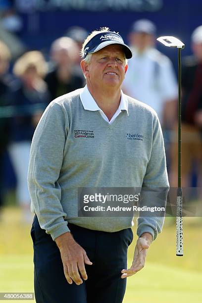 Colin Montgomerie of Scotland reacts to a missed putt on the 16th green by tossing his putter in the air during the first round of the Aberdeen Asset...