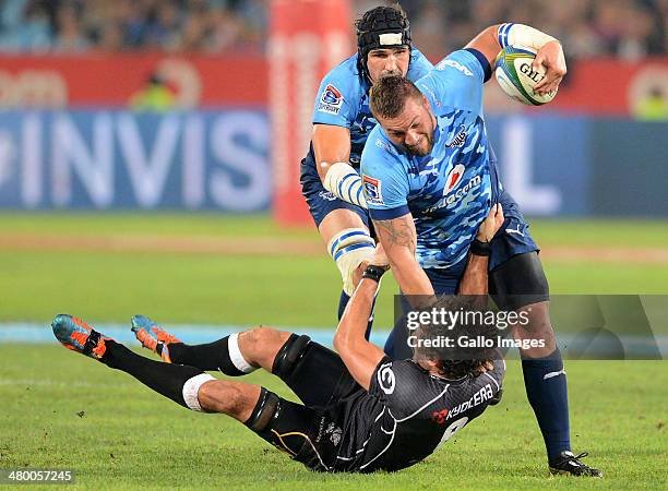 Ryan Kankowski of the Sharks tackles Dean Greyling of the Bulls during the Super Rugby match between Vodacom Bulls and Cell C Sharks at Loftus...