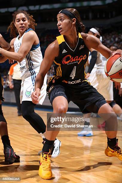 Skylar Diggins of the Tulsa Shock handles the ball against the Minnesota Lynx during the game at Target Center on June 22, 2015 in Minneapolis,...