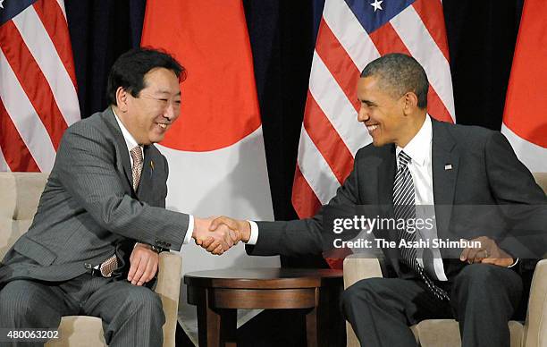 Japanese Prime Minister Yoshihiko Noda and U.S. President Barack Obama shake hands during their bilateral meeting on the sidelines of the...